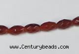 CAA124 15.5 inches 6*10mm faceted rice red agate gemstone beads