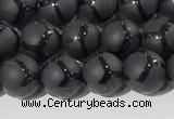 CAA3655 15.5 inches 6mm round matte & carved black agate beads