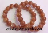 CGB4541 7.5 inches 12mm - 13mm round golden sunstone beaded bracelets