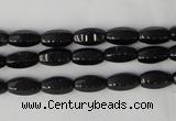 CTO116 15.5 inches 5*10mm faceted rice black tourmaline beads